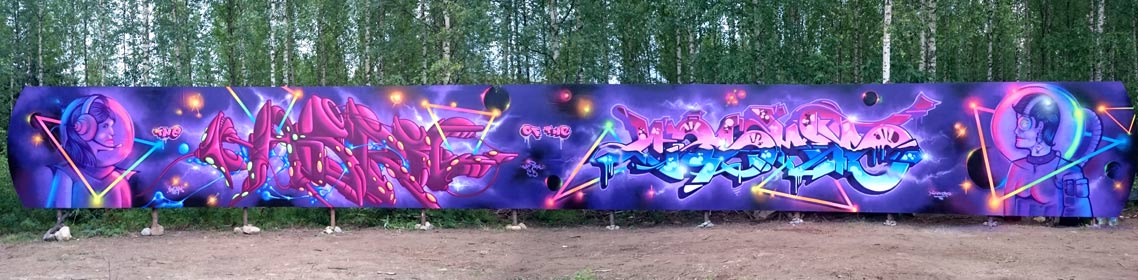 purple coloured graffiti on a long plywood wall