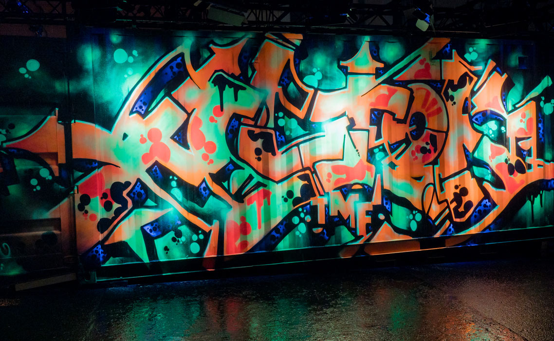 Acton neon graffiti on a sea container.